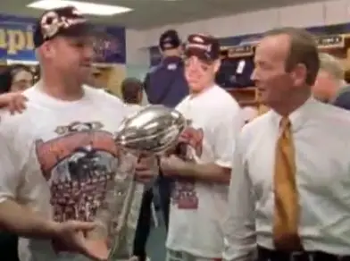 Gary Zimmerman hoisting the Lombardi Trophy after helping lead the Denver Broncos to a Super Bowl victory. 