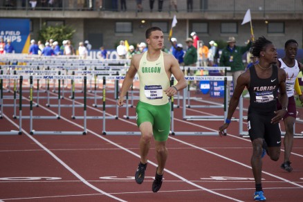 Devon Allen finishes his heat of the 110 meter hurdles in first place.  