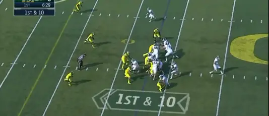 Buckner keeps Walker (#35) from being blocked, allowing him to engage the running back.