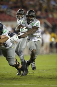 Royce Freeman (21) using his block to the outside.