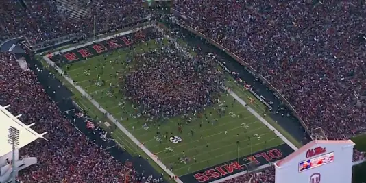 Ole Miss fans stormed the field after their 23-17 upset win over Alabama.