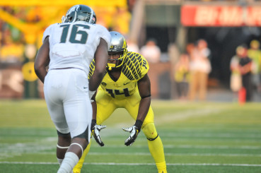 Ifo Ekpre-Olomu (14) lines up against Michigan State.