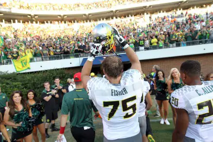 Offensive Lineman Jake Fisher (75) celebrates after a win vs. Virginia in 2013.