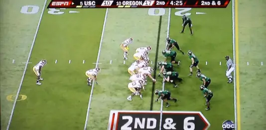 Matthews (#55) is the middle linebacker in Oregon's 4-3 front. 