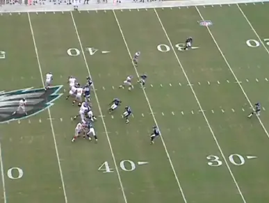 The receiver runs a slant route with the Eagles in man coverage. This clears out the left side of the field.