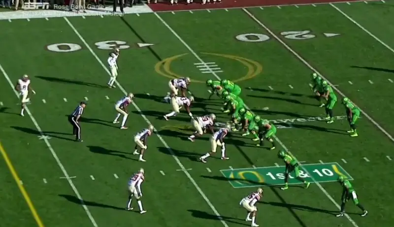 As the Z receiver moves into the backfield, the secondary begins to re-adjust to the new offensive alignment.