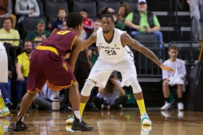 Elgin Cook playing some defense against Arizona State. Photo by: Donald Alarie