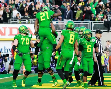 The Oregon team stands united as they prepare for the national championship game against Ohio State.