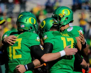Freshman Taylor Alie, left, and sophomore Jeff Lockie are amongst those vying for the Ducks starting quarterback job.