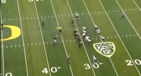 Oregon about to gash Colorado's Cover 2 with an inside handoff