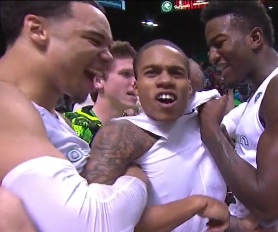 Joseph Young (center) celebrates with Dillon Brooks (left) and Jordan Bell. (right)