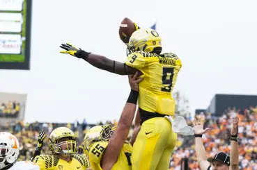 Byron Marshall celebrating a touchdown with his teammates