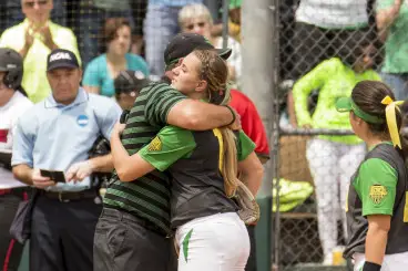 Karissa Hovinga hugs coach White after pitching for the last time at Howe Field