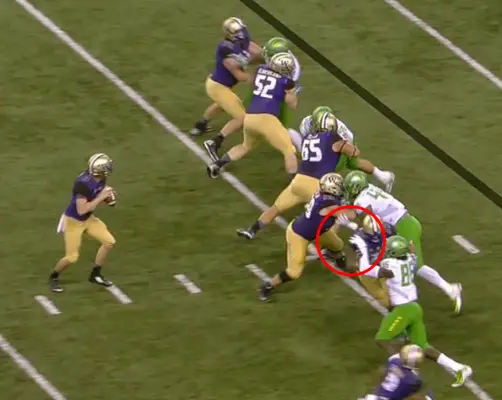 Buckner has the guard right where he wants him, and the RT is holding Torrodney Prevot's arm.