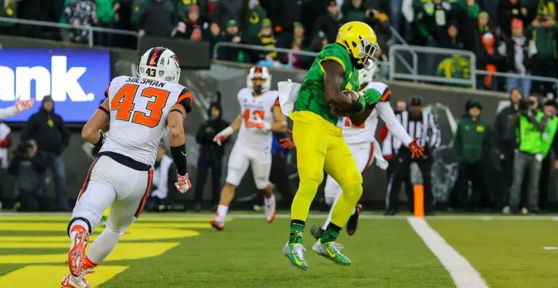 Bralon Addison scores one of his four touchdowns against Oregon State.