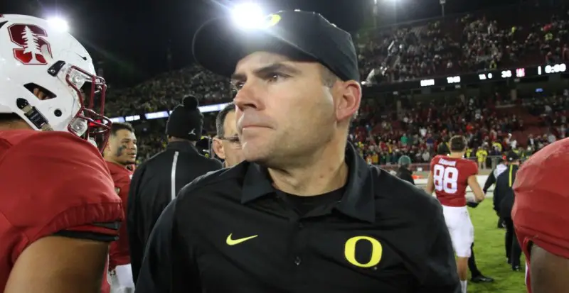 Mark Helfrich looks for David Shaw following Saturday's win. Helfrich has won two of the three matchups between the two as head coaches.