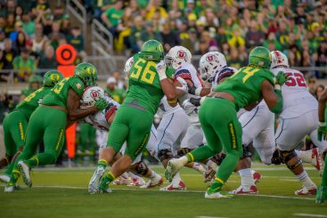 The Oregon Defensive line attacking