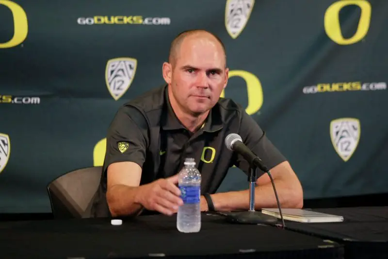 Mark Helfrich answers questions from the media.