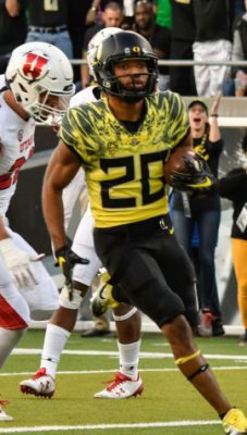 Justin Herbert Oregon Ducks Unsigned Yellow Jersey Running with Ball vs.  Arizona State Photograph