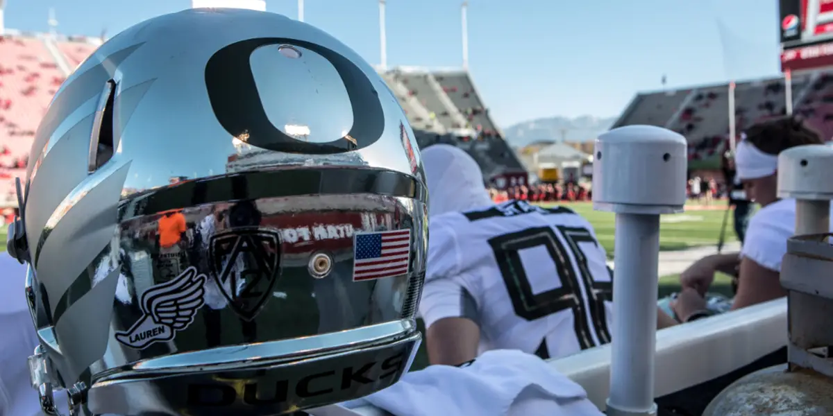 A reflective silver Oregon Ducks football helmet.