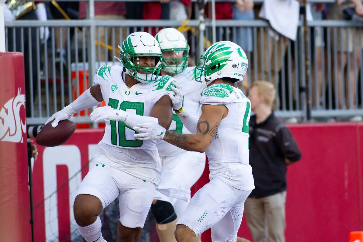 Oregon linebacker Mase Funa celebrates after his interception and score to seal the win for the Ducks at Wazzou. 