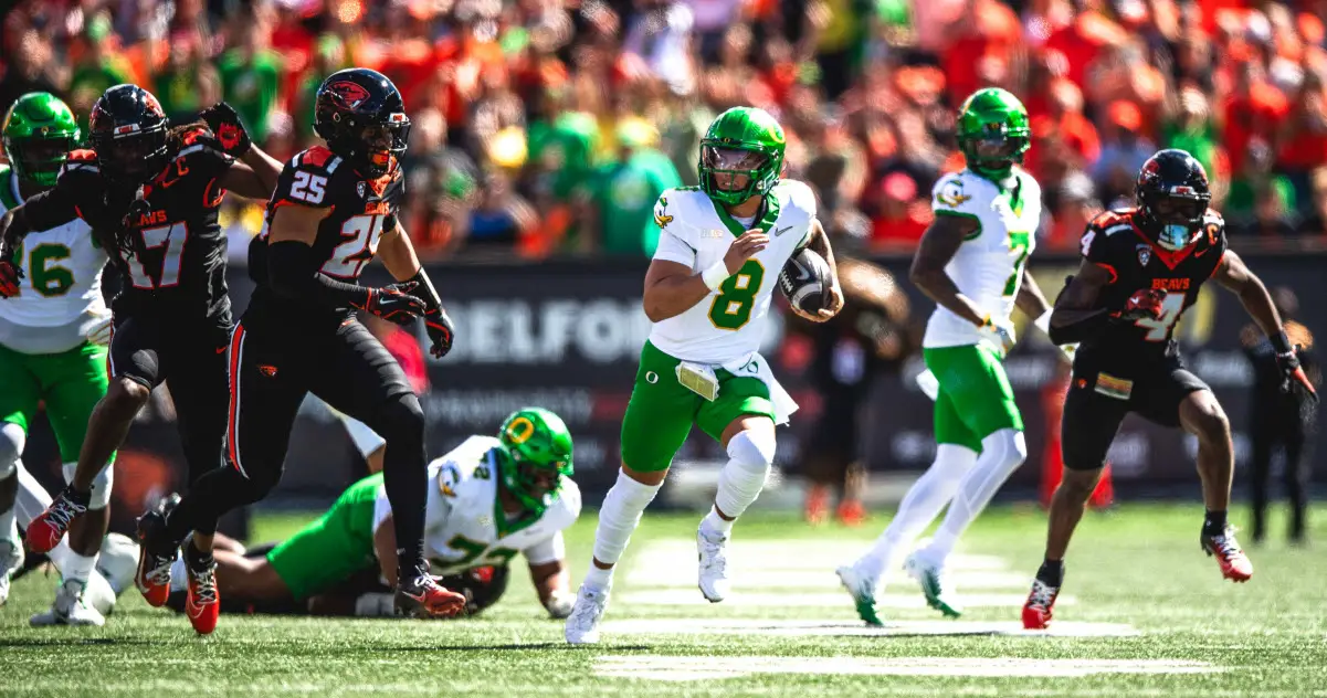 Dillon Gabriel runs for a 54-yard touchdown against the Beavers on Saturday in the 128th Civil War rivalry game at Reser Stadium. Photo by Stephen Chan