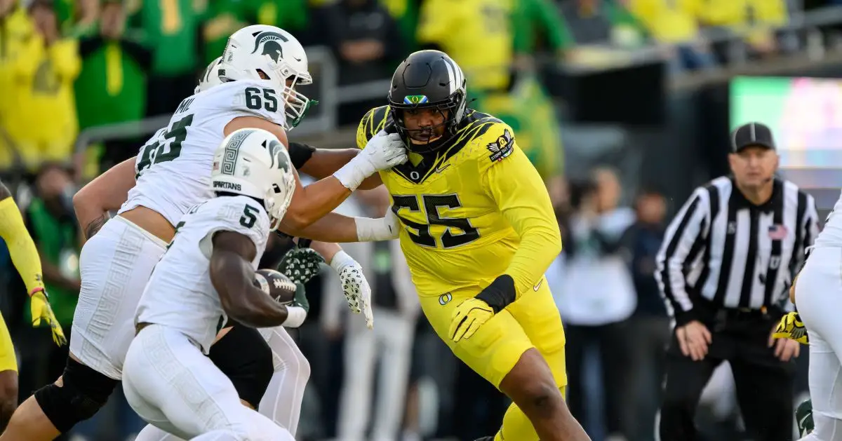 Oregon's Derrick Harmon hunts down the Spartans' ball carrier on Friday night. Photo by Craig Strobeck 