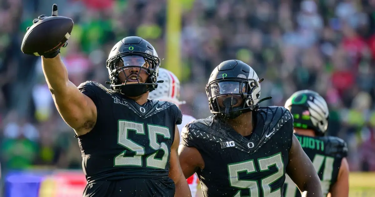 Oregon's Derrick Harmon rips the ball away from OSU's Quinshon Judkins in the Ducks' 32-31 victory earlier this year. Photo by Eric Becker