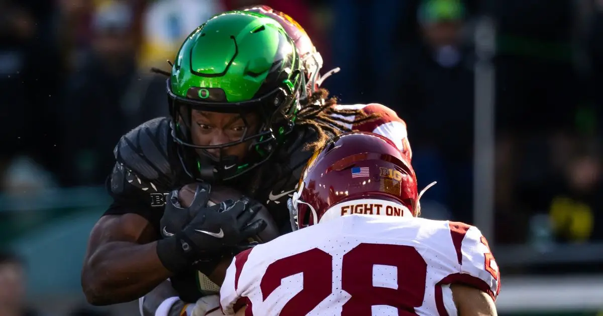Oregon's leading rusher Noah Whittington powers thourhg Trojans defenders during the Ducks 42-27 victory last Saturday over USC. Photo by Max Unkrich