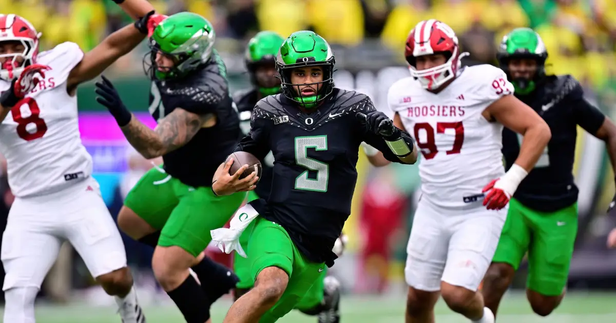 Oregon Football - Dante Moore scrambles vs the Indiana Hoosiers - FishDuck.com in Eugene, OR